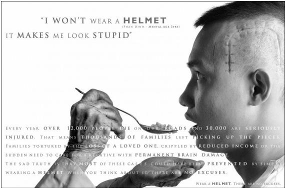 Ad provoking fear to encourage wearing a helmet, man being spoon-fed "I won't wear a helmet, it makes me look stupid"