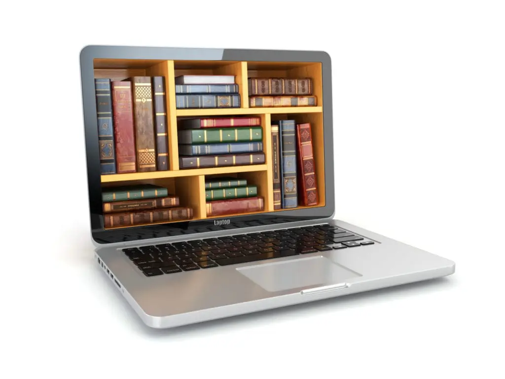 Photo of laptop with books on shelf on screen - microlearning concept