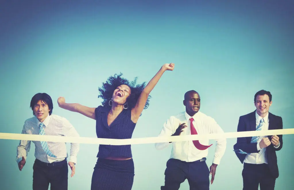 4 Runners at finish line for empower lifelong learners concept