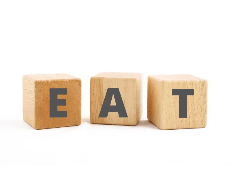 Letters E-A-T on wood blocks - build a consulting brand concept