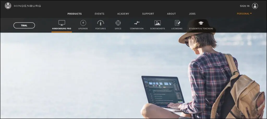 Hindenburg homepage
woman sitting with backpack on and laptop open 
