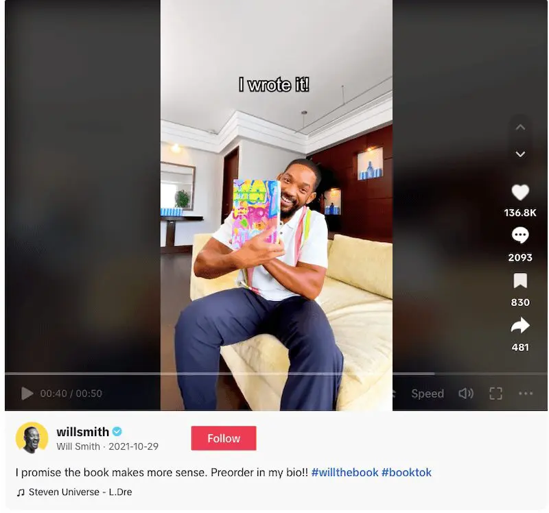Will Smith holding his book sitting on a couch with text "I wrote it!" overlaying. 