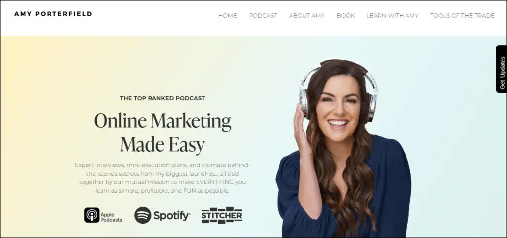 Amy Porterfield website homepage
Text says
The Top Ranked Podcast
Online Marketing Made Easy
Image on woman with headphones on