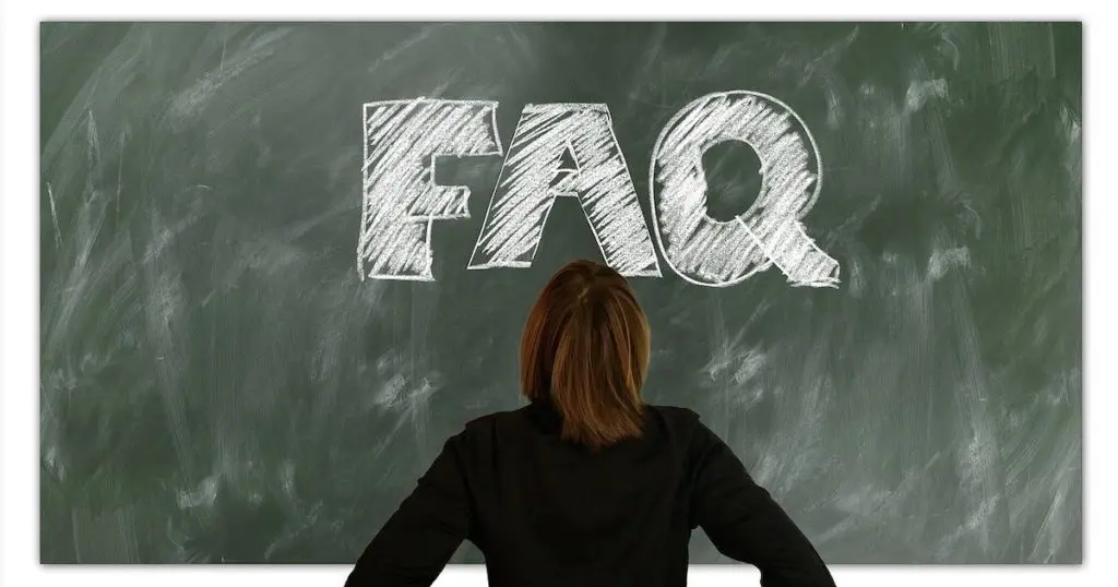 an chalkboard with FAQ written on it to represent questions about how to sell online courses