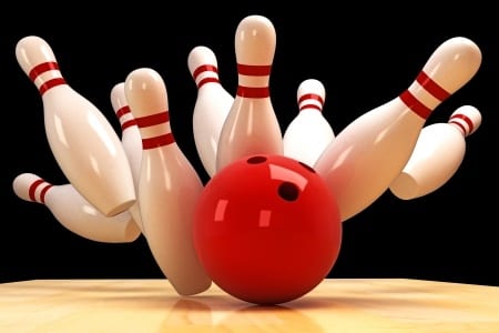 Picture of bowling pins as ball hits them