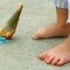 dropped ice cream cone at child's feet