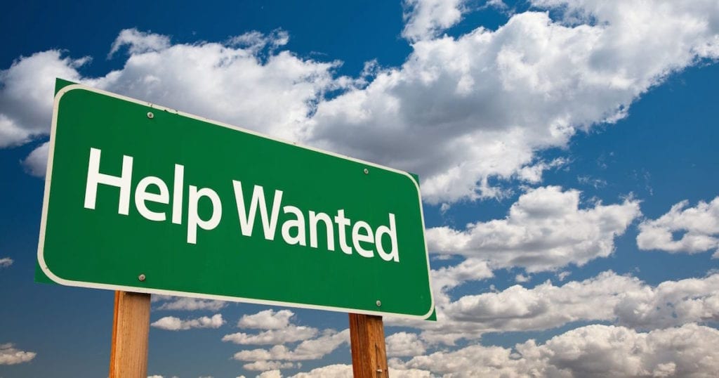Image of help wanted green road sign