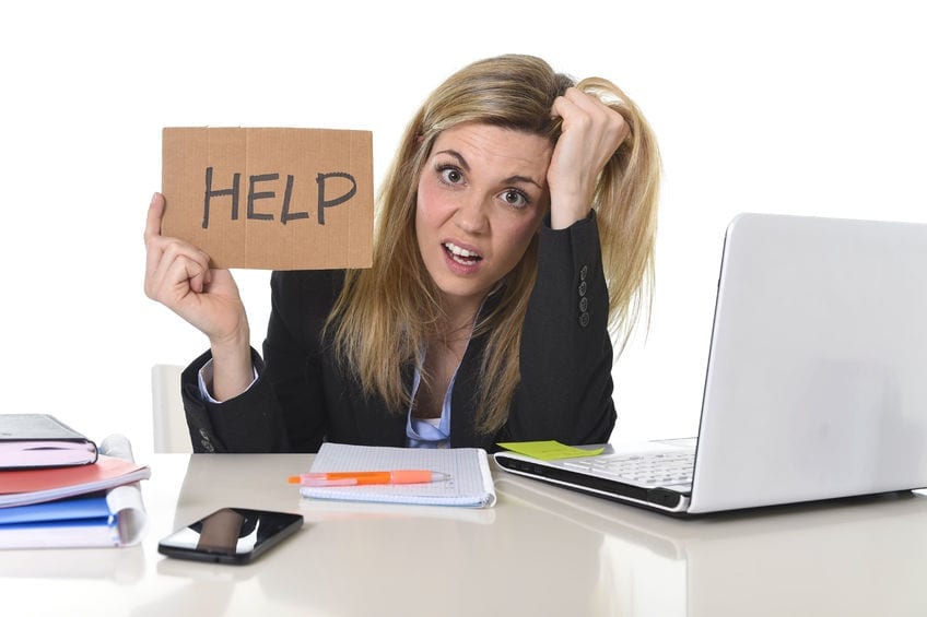 Picture of overwhelmed female entrepreneur who wants help to offload marketing