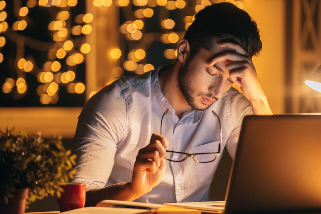 Photo of frustrated man at laptop representing failure of online course creators