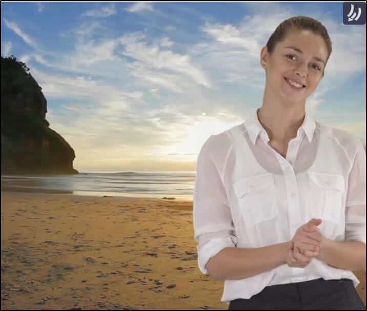 Women dressed professionally standing on the beach with water and sunset in background, portaying as her green screen
