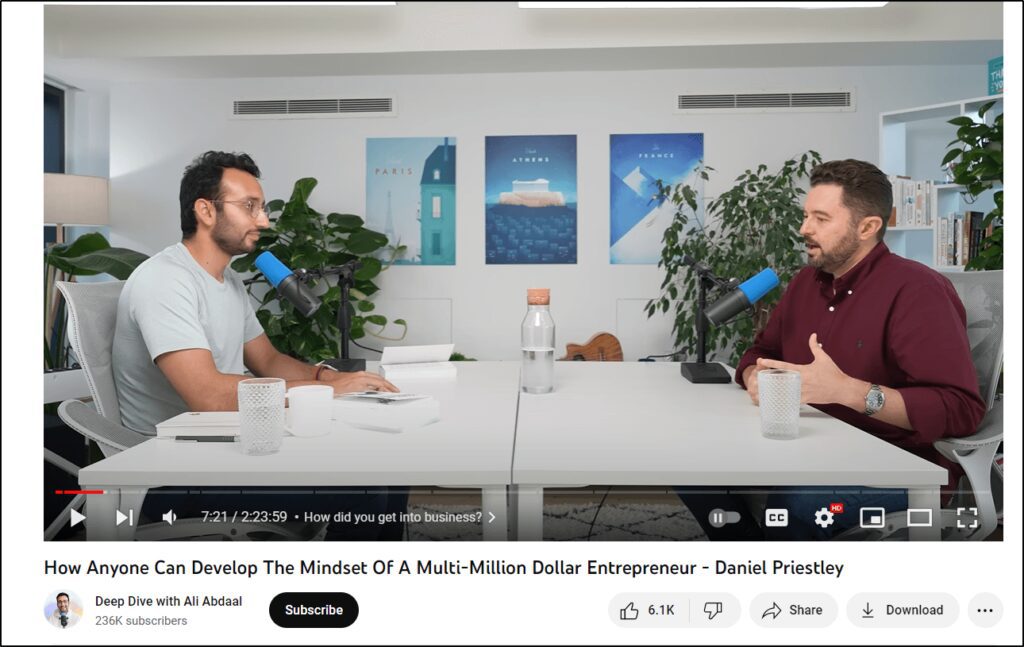 Screenshot of YouTube video of Ali Abdaal sitting across from Daniel Priestley for a podcast interview segment