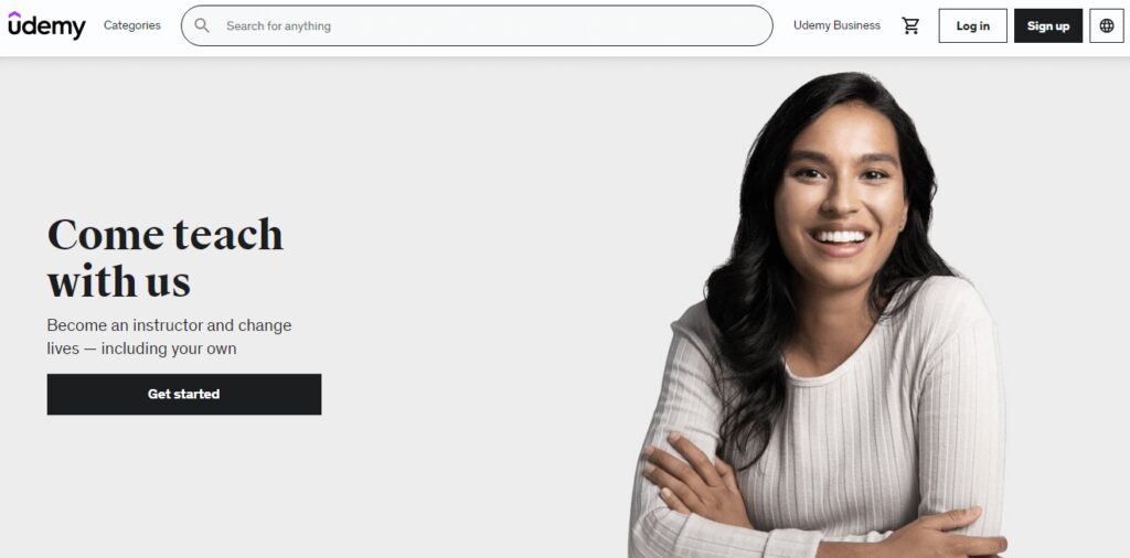 Udemy home page - "Come teach with us", picture of girl with arms folded