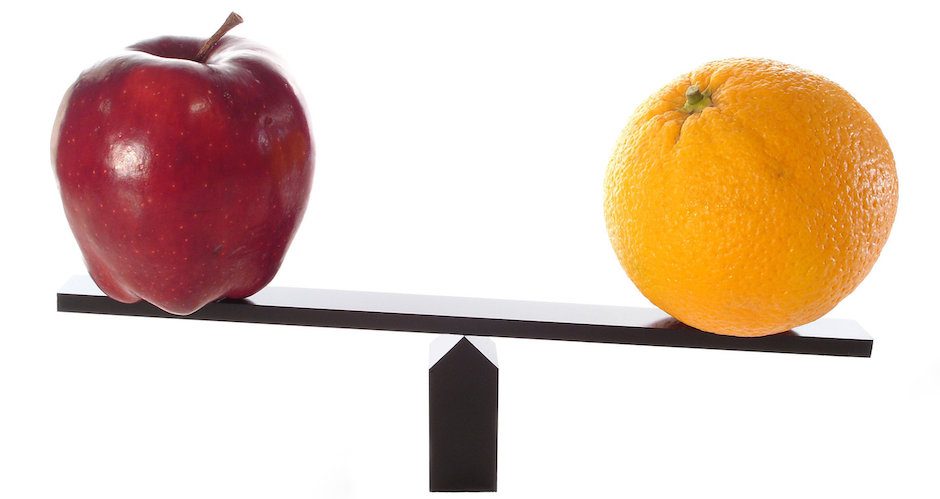 Apple and orange on balancing scale for alternatives to Udemy concept