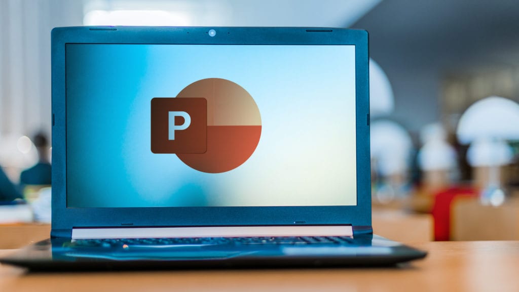 Laptop computer displaying logo of Microsoft PowerPoint